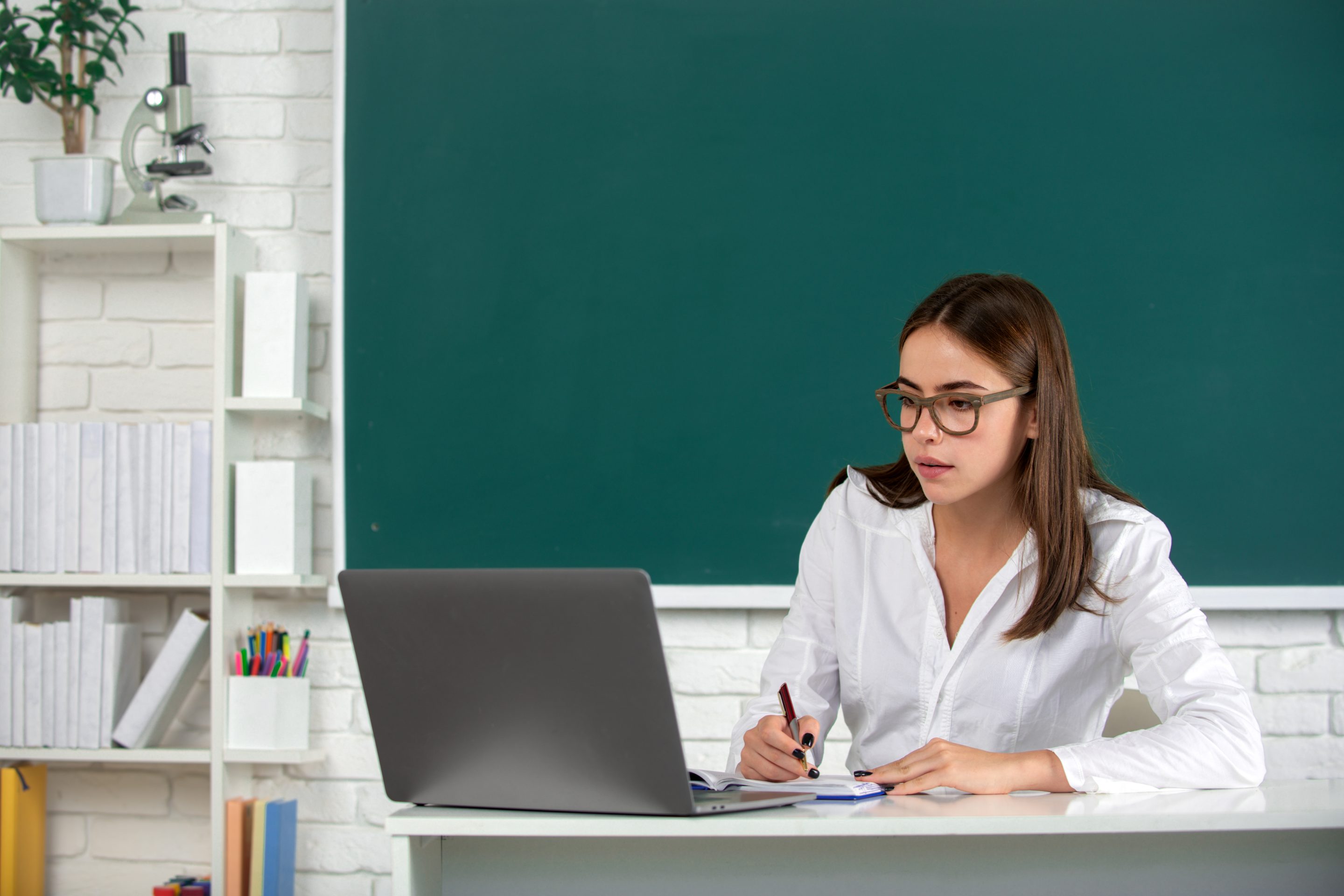 Portrait of female university student study lesson at school or university, online learning at school, distance education.